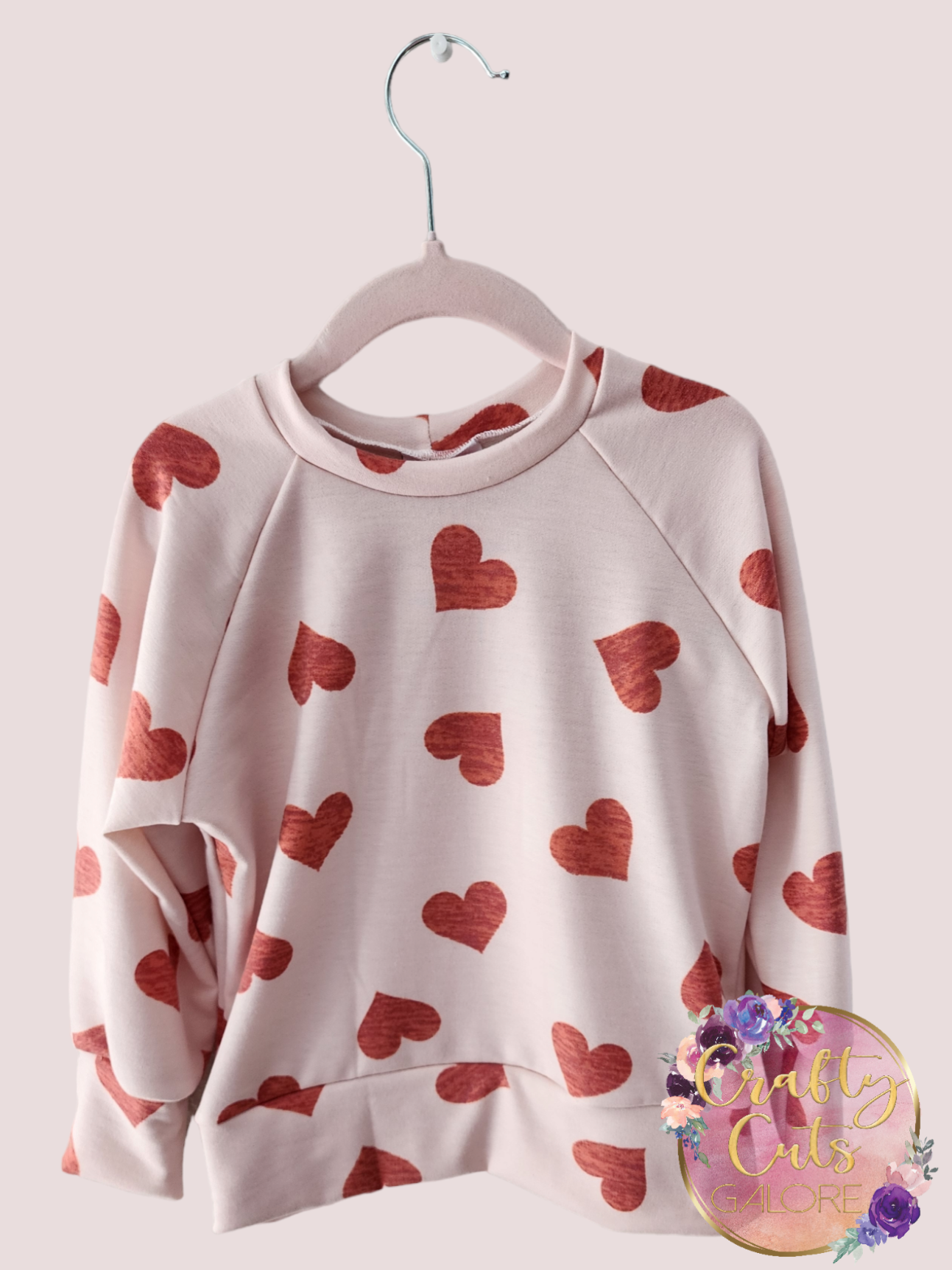 Hearts on pink sweater